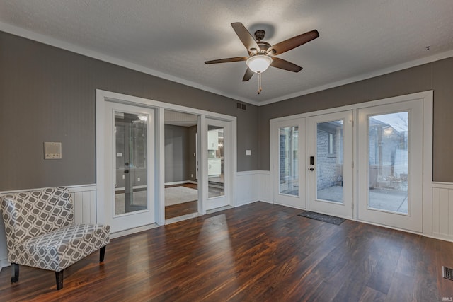 interior space with french doors, a textured ceiling, dark hardwood / wood-style floors, and ceiling fan