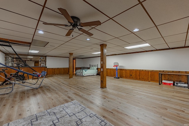 playroom featuring a paneled ceiling, ceiling fan, and light hardwood / wood-style floors