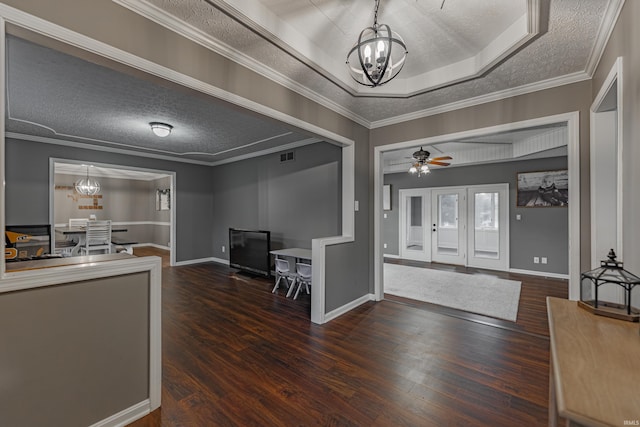 foyer with ceiling fan with notable chandelier, a textured ceiling, and dark hardwood / wood-style flooring