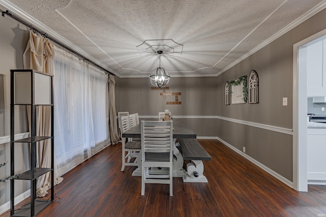 unfurnished dining area featuring a textured ceiling, crown molding, dark wood-type flooring, and a chandelier