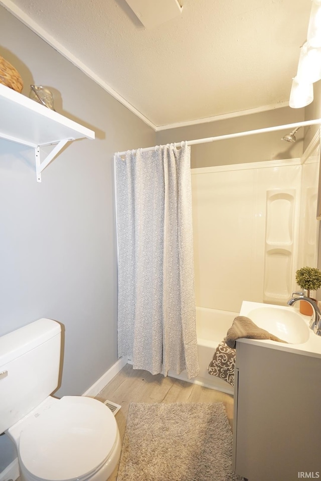 full bathroom with hardwood / wood-style floors, vanity, toilet, shower / bathtub combination with curtain, and ornamental molding