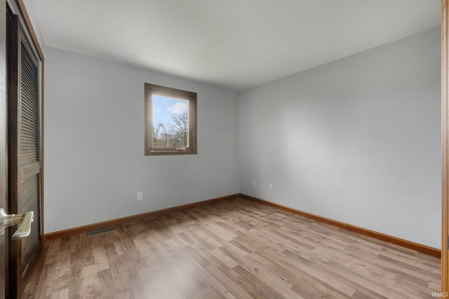 unfurnished bedroom featuring light wood-type flooring