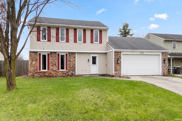 view of front of property featuring a front lawn and a garage