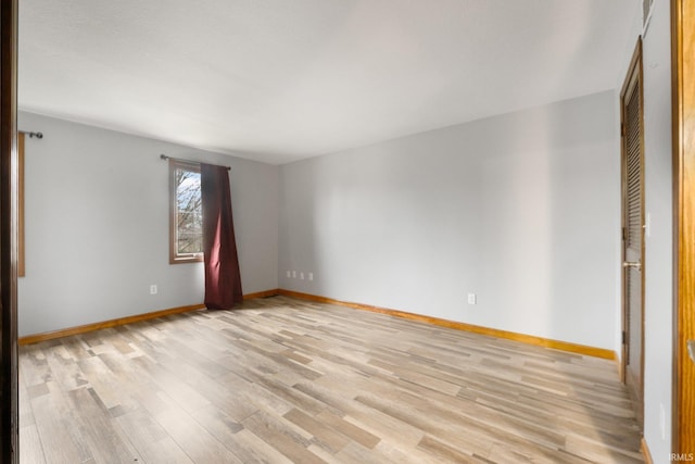 spare room with light wood-type flooring