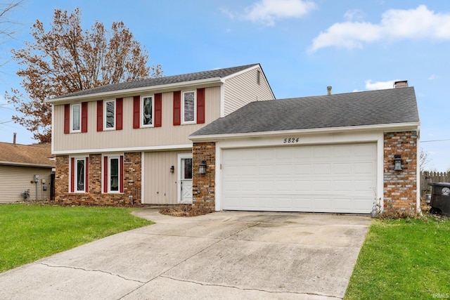 view of front facade featuring a garage and a front lawn