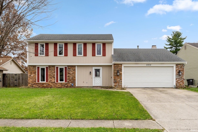 view of front of house featuring a front yard and a garage