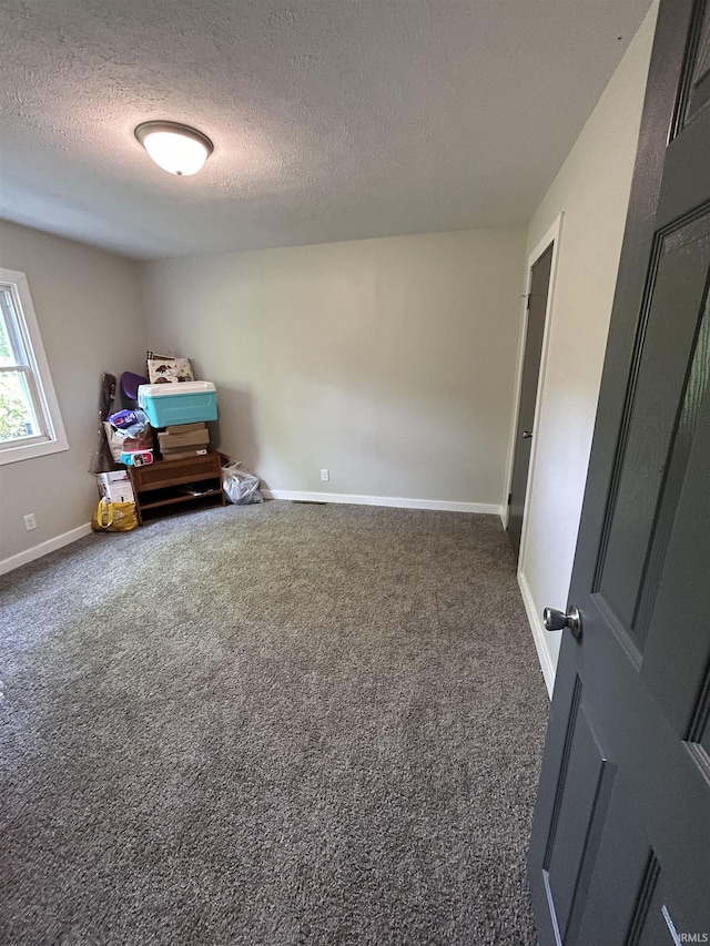 interior space featuring a textured ceiling