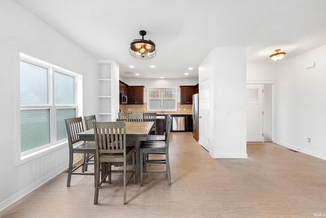 dining area with light hardwood / wood-style floors