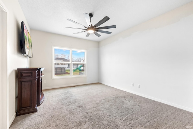 unfurnished living room with light carpet and ceiling fan