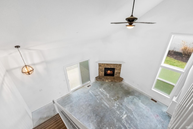 unfurnished living room featuring concrete flooring, high vaulted ceiling, and ceiling fan