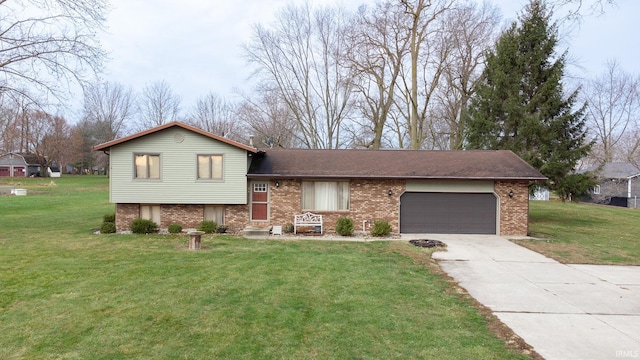 tri-level home featuring a garage and a front lawn