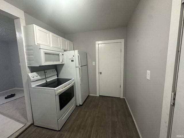 kitchen featuring white cabinetry, dark hardwood / wood-style flooring, and white appliances