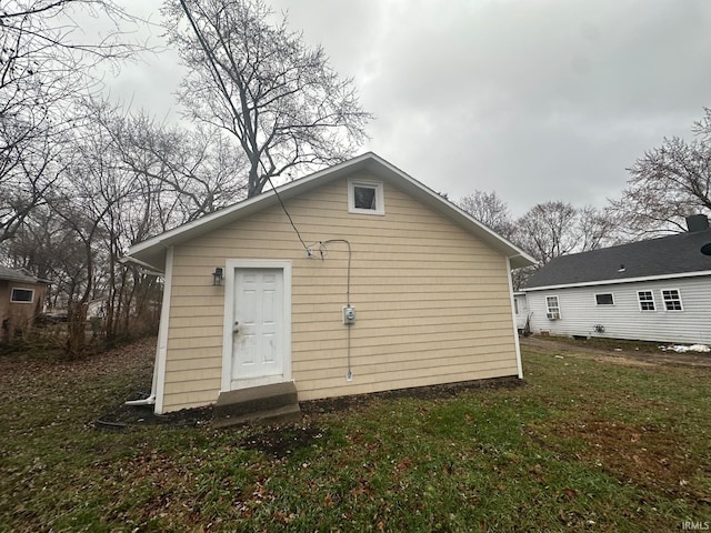 view of outbuilding featuring a yard