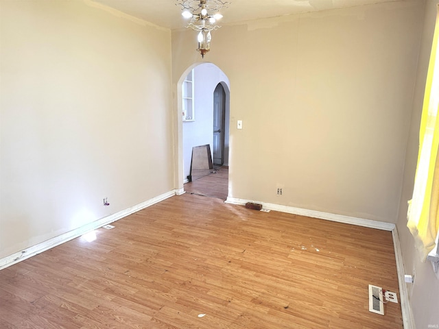 empty room with light hardwood / wood-style flooring