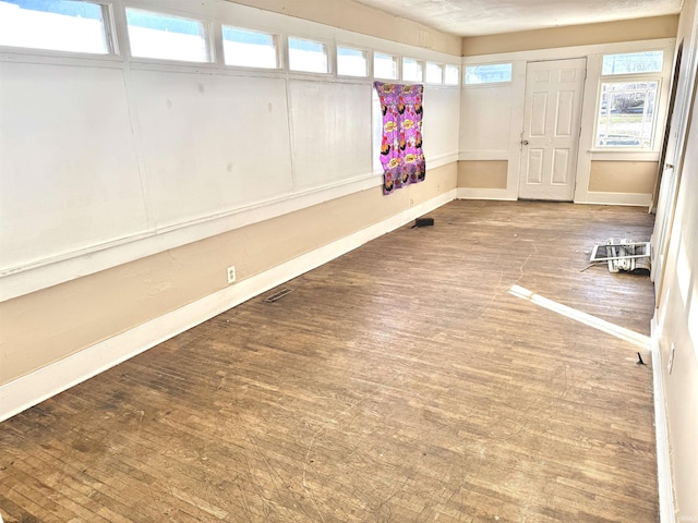 interior space with hardwood / wood-style floors