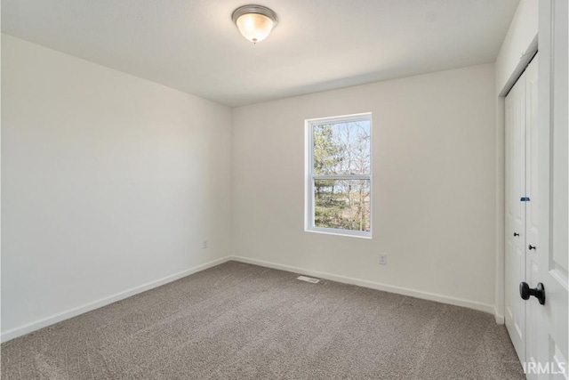 unfurnished bedroom with carpet and a closet