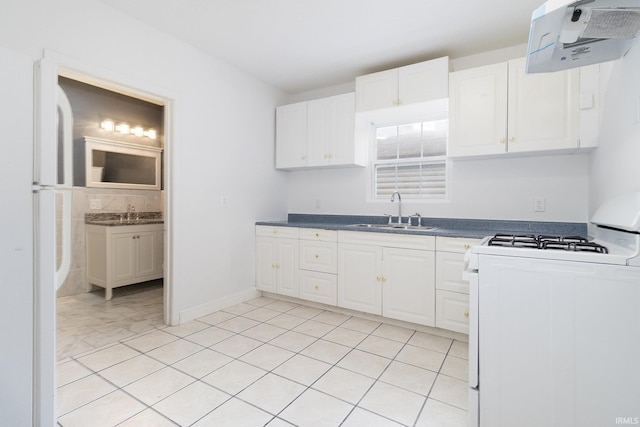 kitchen with white cabinetry, sink, ventilation hood, light tile patterned floors, and white stove