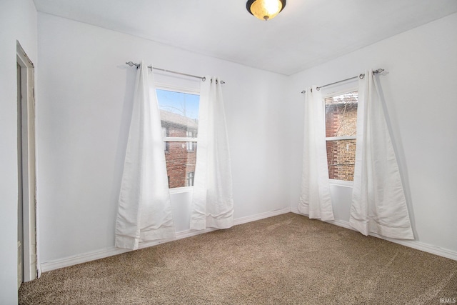 empty room with carpet and plenty of natural light