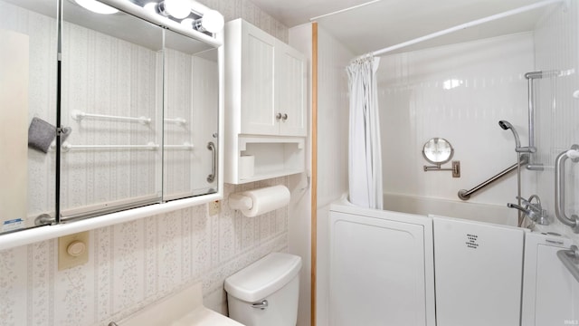 bathroom featuring toilet, washer / dryer, and shower / tub combo with curtain