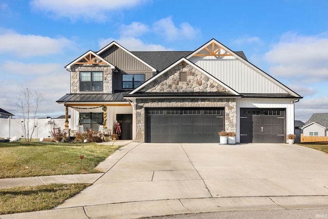 view of front of house featuring a front lawn and a garage