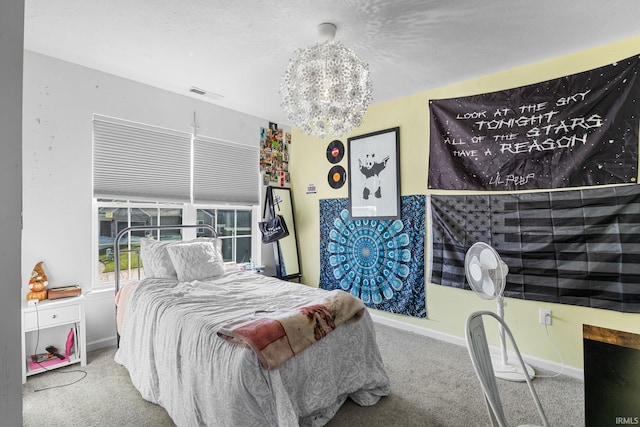 carpeted bedroom with a notable chandelier