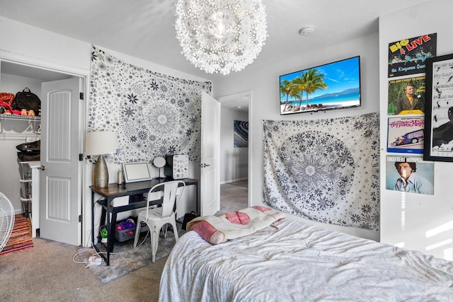 carpeted bedroom with an inviting chandelier