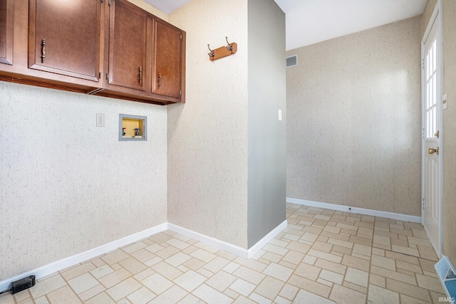 laundry room featuring cabinets and washer hookup