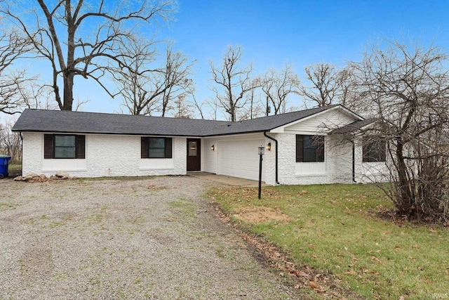 single story home with a garage and a front yard