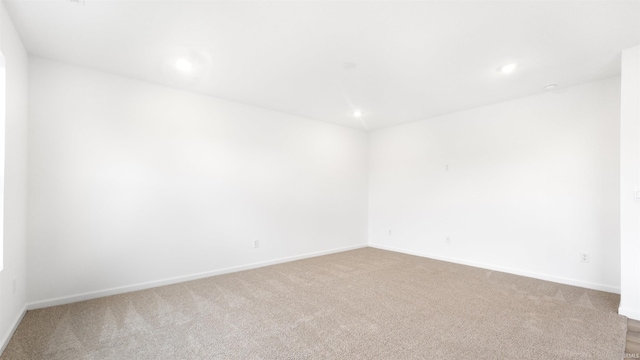 spare room featuring carpet floors