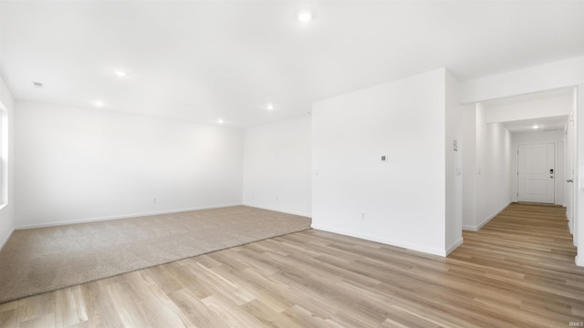 empty room with light hardwood / wood-style flooring