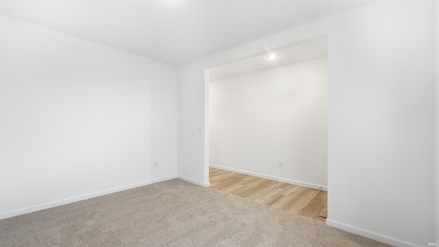 spare room with light hardwood / wood-style floors