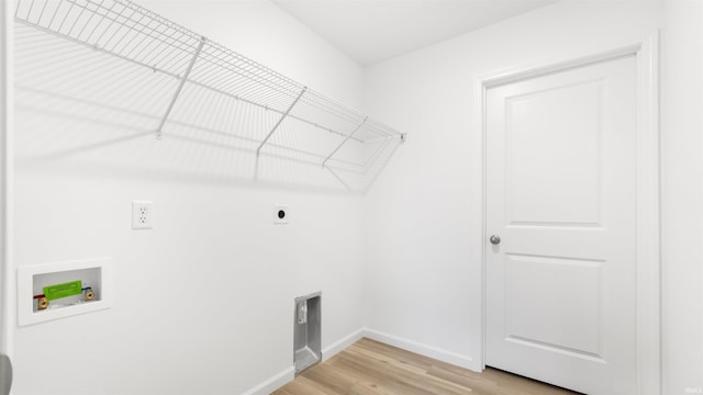 clothes washing area with hardwood / wood-style floors, electric dryer hookup, and hookup for a washing machine