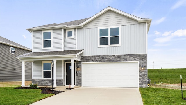 view of front of house featuring a front yard and a garage