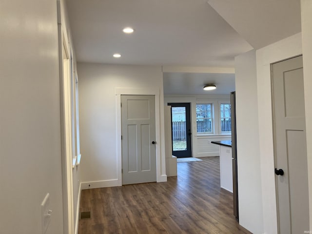 hall with dark wood-type flooring