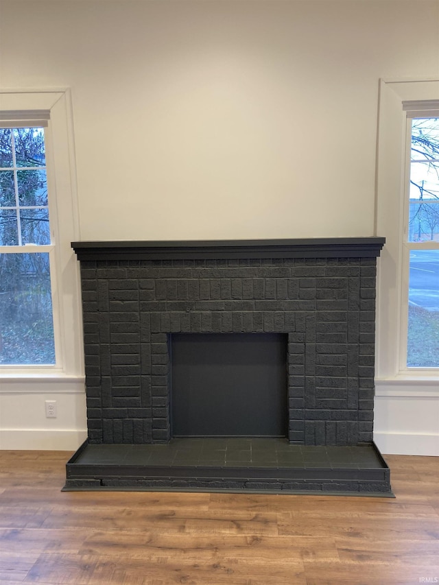 room details featuring hardwood / wood-style flooring and a fireplace