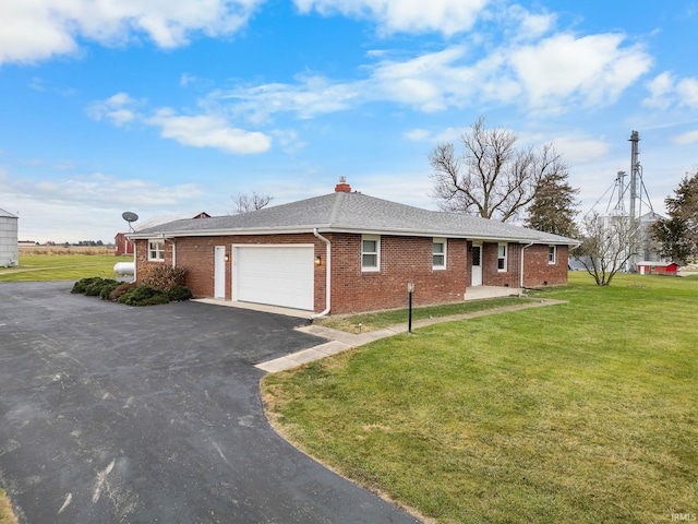 view of home's exterior with a garage and a lawn