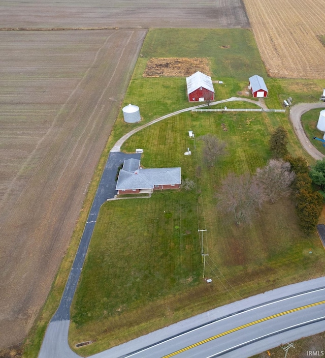 birds eye view of property with a rural view