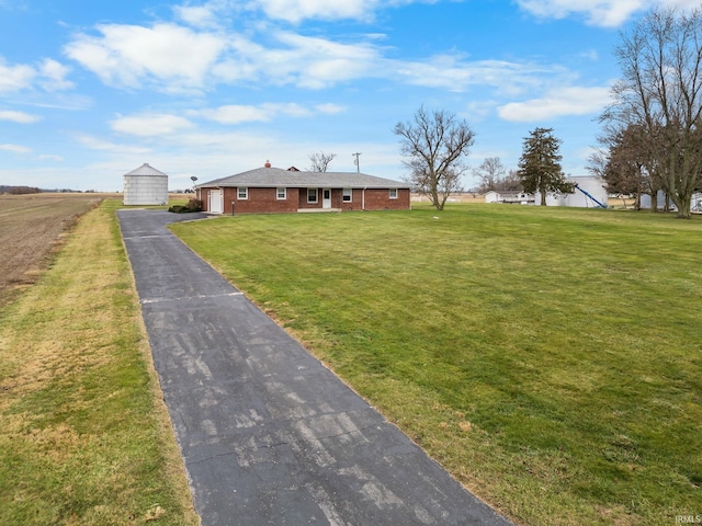 ranch-style house with a front yard