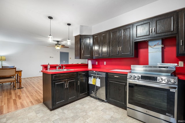 kitchen with sink, ceiling fan, appliances with stainless steel finishes, dark brown cabinets, and kitchen peninsula