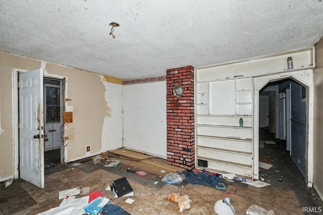 interior space with a textured ceiling