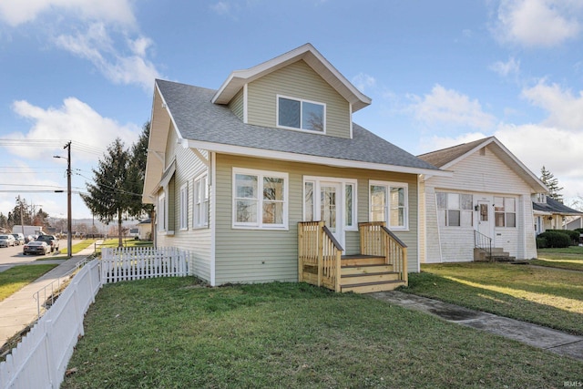 bungalow-style home with a front lawn