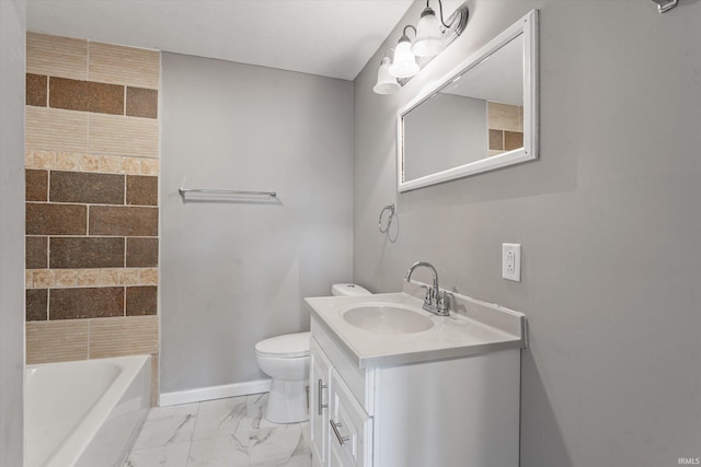 bathroom with vanity, toilet, and a bathing tub