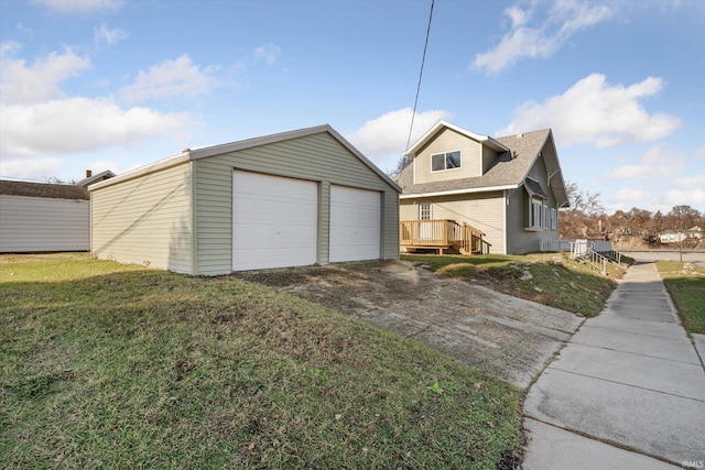 garage featuring a lawn