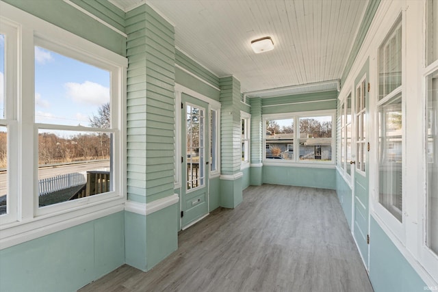 unfurnished sunroom featuring a wealth of natural light