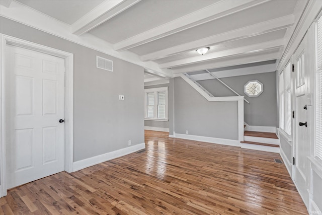 interior space with beamed ceiling and wood-type flooring