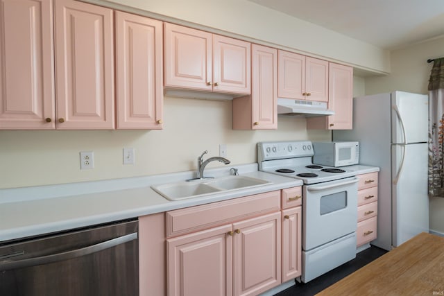 kitchen featuring white appliances and sink