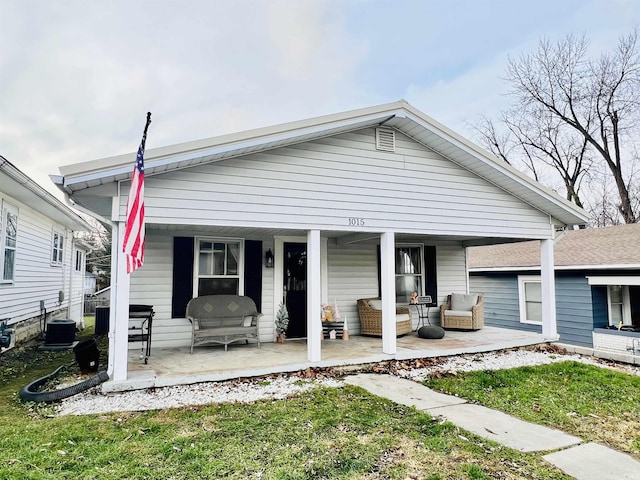 bungalow-style home featuring outdoor lounge area, a patio area, and central AC