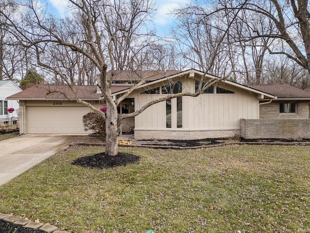 view of front of property with a garage and a front lawn