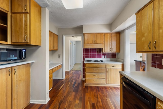 kitchen featuring white gas stovetop, dark hardwood / wood-style floors, black dishwasher, a textured ceiling, and tasteful backsplash