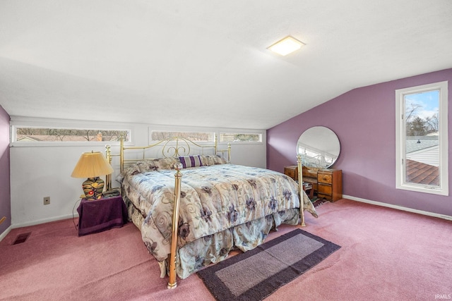 bedroom featuring carpet flooring, multiple windows, and lofted ceiling